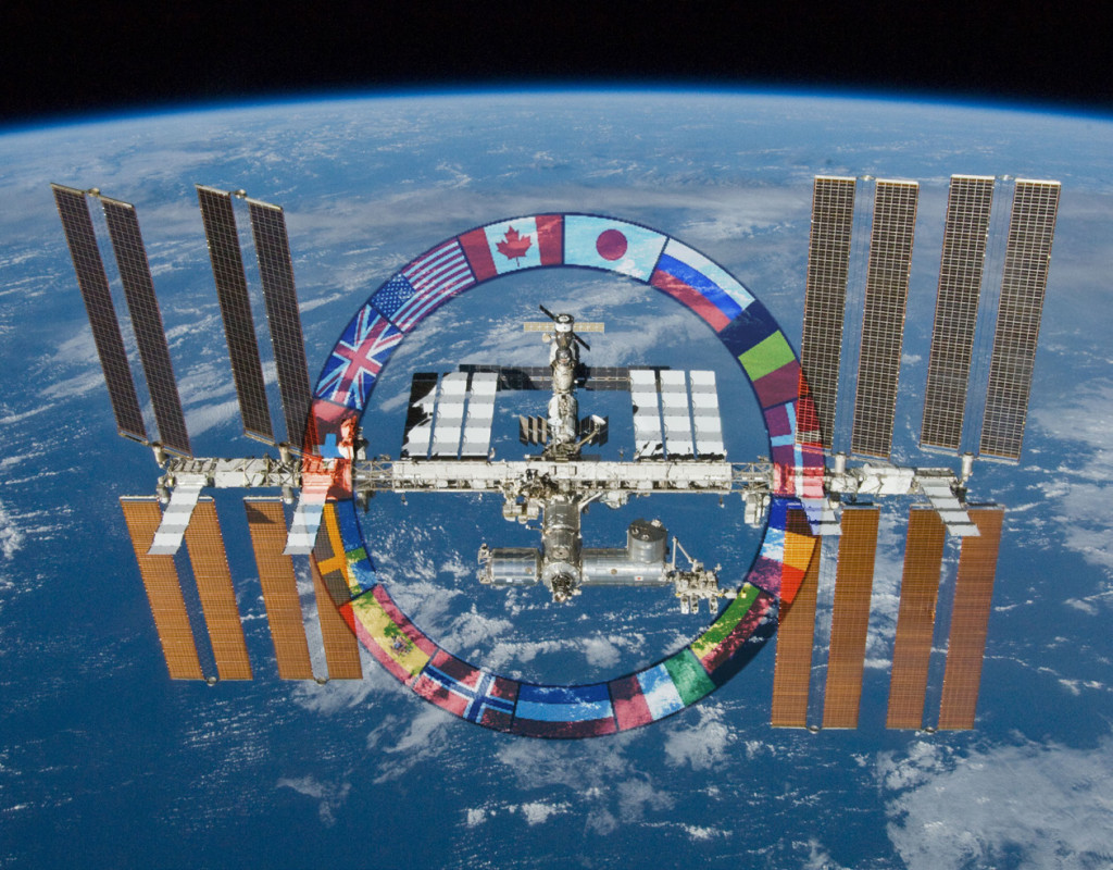 The ISS, with flags of the partner nations. 